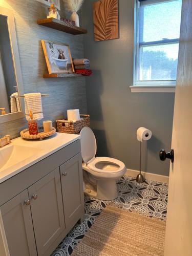 a bathroom with a toilet and a sink at McLaughlin home in Osceola