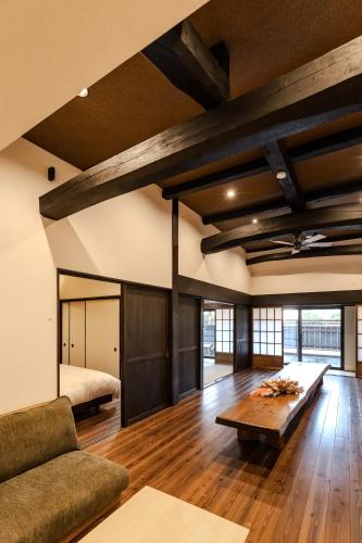 a living room with a couch and a table at moku杢 in Miyazu