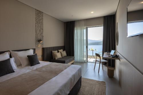 a hotel room with a bed and a desk and a television at Boutique hotel MaViE - Adults Only in Neum