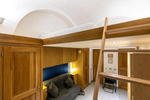 a living room with a bunk bed and a couch at Apt Urbana 156 - Monti in Rome