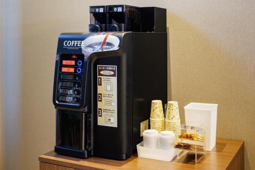 a coffee machine sitting on top of a table at JR-East Hotel Mets Komagome in Tokyo