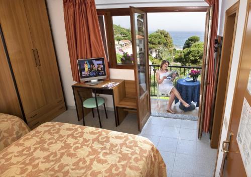 TV a/nebo společenská místnost v ubytování Hotel Da Fine