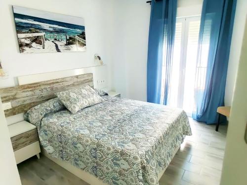 Кровать или кровати в номере Apartamentos Nazareno para familias y parejas
