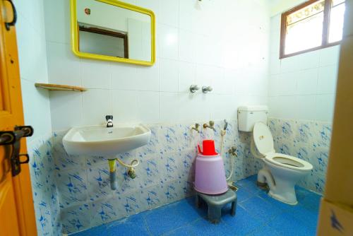 Koupelna v ubytování AMOGHA RESIDENCY