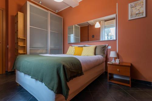 a bedroom with a large bed and a window at Sui tetti di Torino by Wonderful Italy in Turin