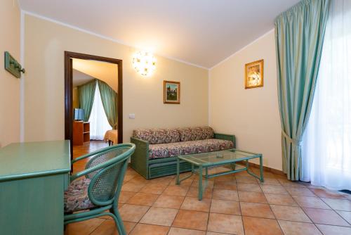 a living room with a couch and a table at Hotel Il Ceppo in Agropoli