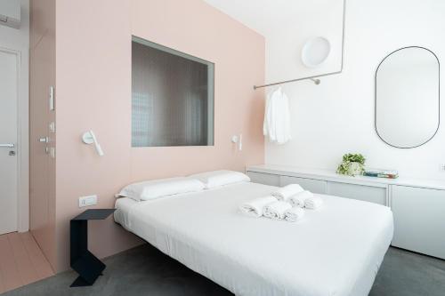 Postel nebo postele na pokoji v ubytování VIVO Rooms