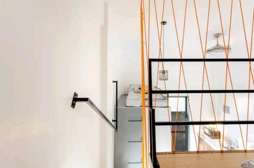 a room with a staircase and a window at Kua's Pad Tagaytay in Tagaytay