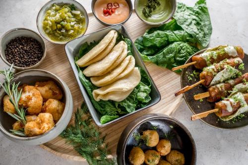 a table topped with different types of food and dishes at Kloster by b-smart in Schaan