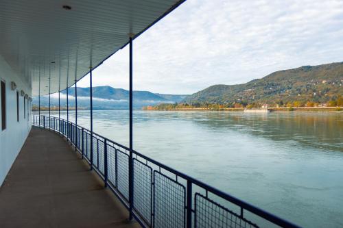 a view of a river from the side of a building at Aquamarina Hotel Visegrád in Visegrád