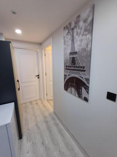 a room with a picture of the eiffel tower on the wall at White Palace Haliç in Istanbul