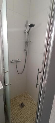 a shower in a bathroom with a shower at Sirius - SILS in Caen