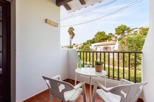 a balcony with a table and chairs and a view at Apartamentos en Son Bou in Son Bou