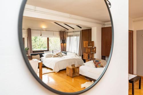 a bedroom with two beds and a mirror at B&B Villa Sumrak Plitvica in Plitvica Selo