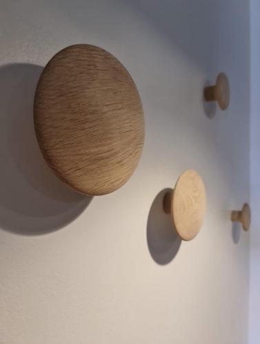 a wall with a wooden object on a wall at Studio Centre Douai - Wifi in Douai
