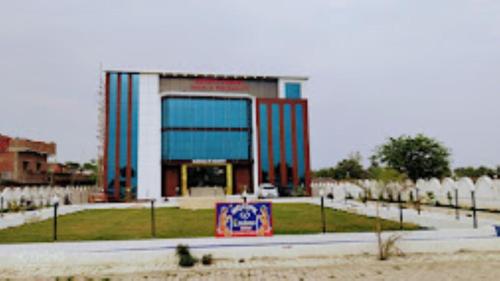 a building with a sign in front of it at Buddha Resort hotel & restaurant,Aurangabad in Aurangābād