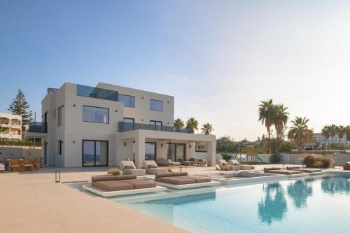 a rendering of a villa with a swimming pool at Asea Villa, Spectacular right-on-the-beach Retreat, By ThinkVilla in Skaleta