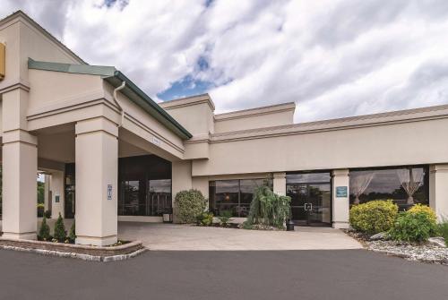 a large office building with a lot of windows at Ramada Inn by Wyndham Fairfield NJ in Fairfield