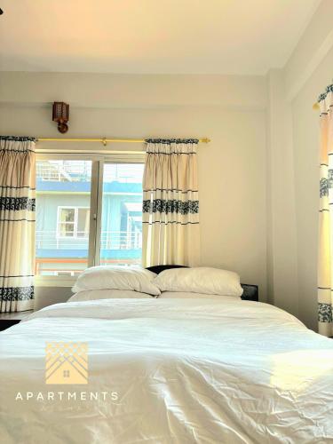 Cama o camas de una habitación en Nishan Apartments -Lakeside