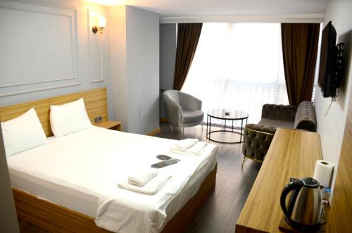 Postel nebo postele na pokoji v ubytování Waves hotel