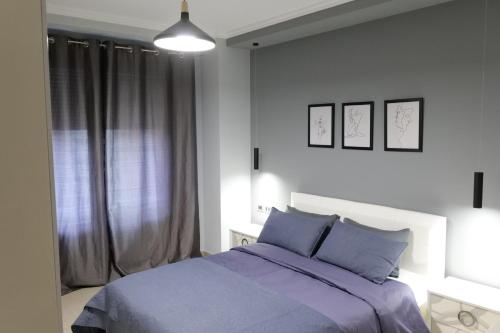 Ένα ή περισσότερα κρεβάτια σε δωμάτιο στο Luxury condo in Tirana