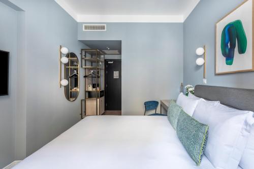 Letto o letti in una camera di Numa Rome Linea