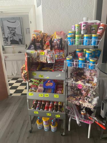 a store shelf filled with different types of food at The Cosy Nook in Blackpool