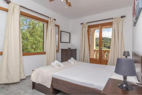 En eller flere senger på et rom på Casa Rural Pili Mallorca