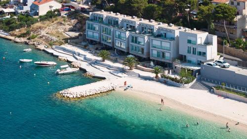 an aerial view of a beach with buildings and water at Livingstone Beach House in Trogir