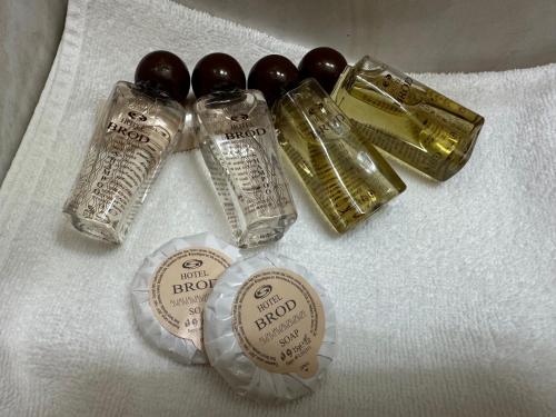 a group of different types of glass items on a towel at Hotel Brod - Free Parking in Sofia