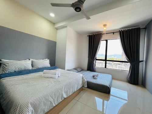 a bedroom with a bed and a window at P3 Cozy Stay / Waterpark / 7-8pax Ipoh in Ipoh