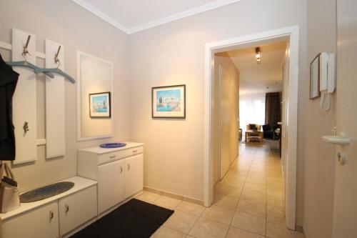 a bathroom with a sink and a mirror at Am Stadtwald in Kühlungsborn