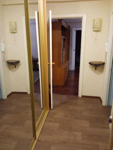 a mirror in a room with a hallway at 1к Квартира бульвар Котляревського, бульвар Праці буд 1 in Kyiv