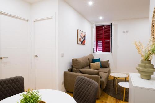 a living room with a couch and a chair at Gibraltar Nest 5-Hosted by Sweetstay in Gibraltar