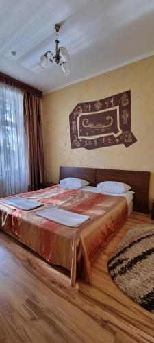a bedroom with a large bed in a room at Готельно-Ресторанний Комплекс Три Бобри in Litowiż