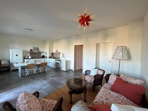 a living room with a couch and a table at Ferienwohnung beethoven-12 in Zittau