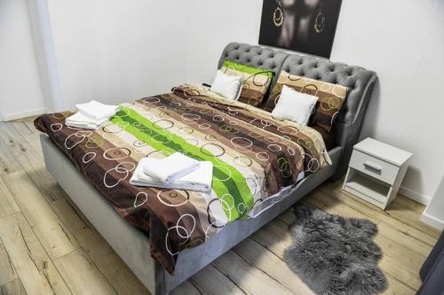 a bedroom with a large bed with at MH Residence in Cluj-Napoca