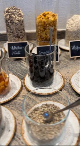 a table topped with plates with a cup of food at Bauer Hotel und Restaurant in Feldkirchen