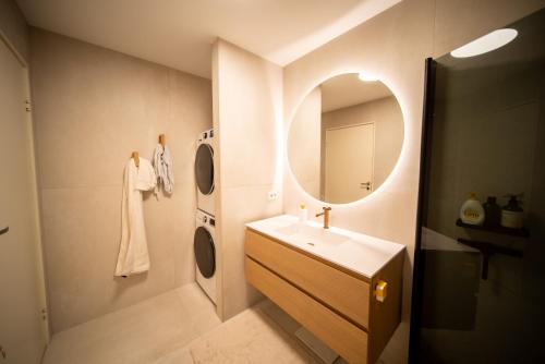 a bathroom with a sink and a mirror at Tromsø Town House in Tromsø