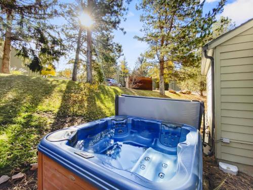 a hot tub in the backyard of a house at 37C Hidden Creek Mountain Getaway! condo in Park City
