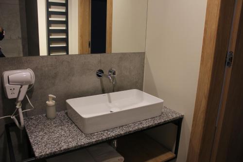 a white sink on a counter in a bathroom at MDS Bonikowo in Bonikowo