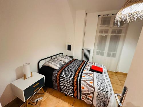 a bedroom with a bed and a television in it at Appartement T3 67m² in Perpignan