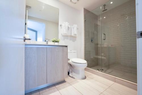 a bathroom with a toilet and a shower at Zen Beach House Luxury 1-Bedroom Intracoastal Views in Hollywood