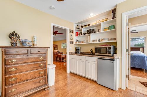 a kitchen with a sink and a microwave at Summit Lake Guesthouse in Kamilche