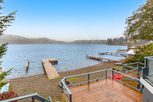 a view of a lake with a dock at Summit Lake Guesthouse in Kamilche