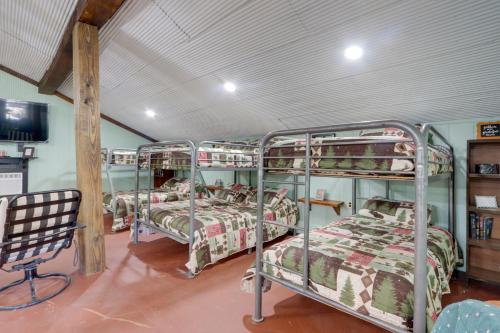 a group of bunk beds in a room at Bunkhouse-Style Studio in Elkins Near ATV Trails! in Elkins