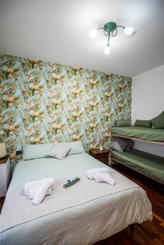a bedroom with a bed with two towels on it at Brigida B&B in Monteprandone