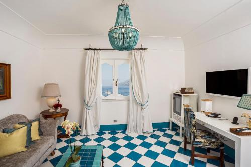 a living room with a blue and white checkered floor at Villa Treville in Positano