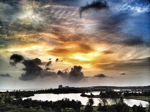 a view of a cloudy sky with a river at Stunning 2 brm designer View condo in Maho in Lowlands