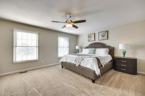 a bedroom with a bed and a ceiling fan at Spacious Colorado Springs Home with Fire Pit! in Colorado Springs